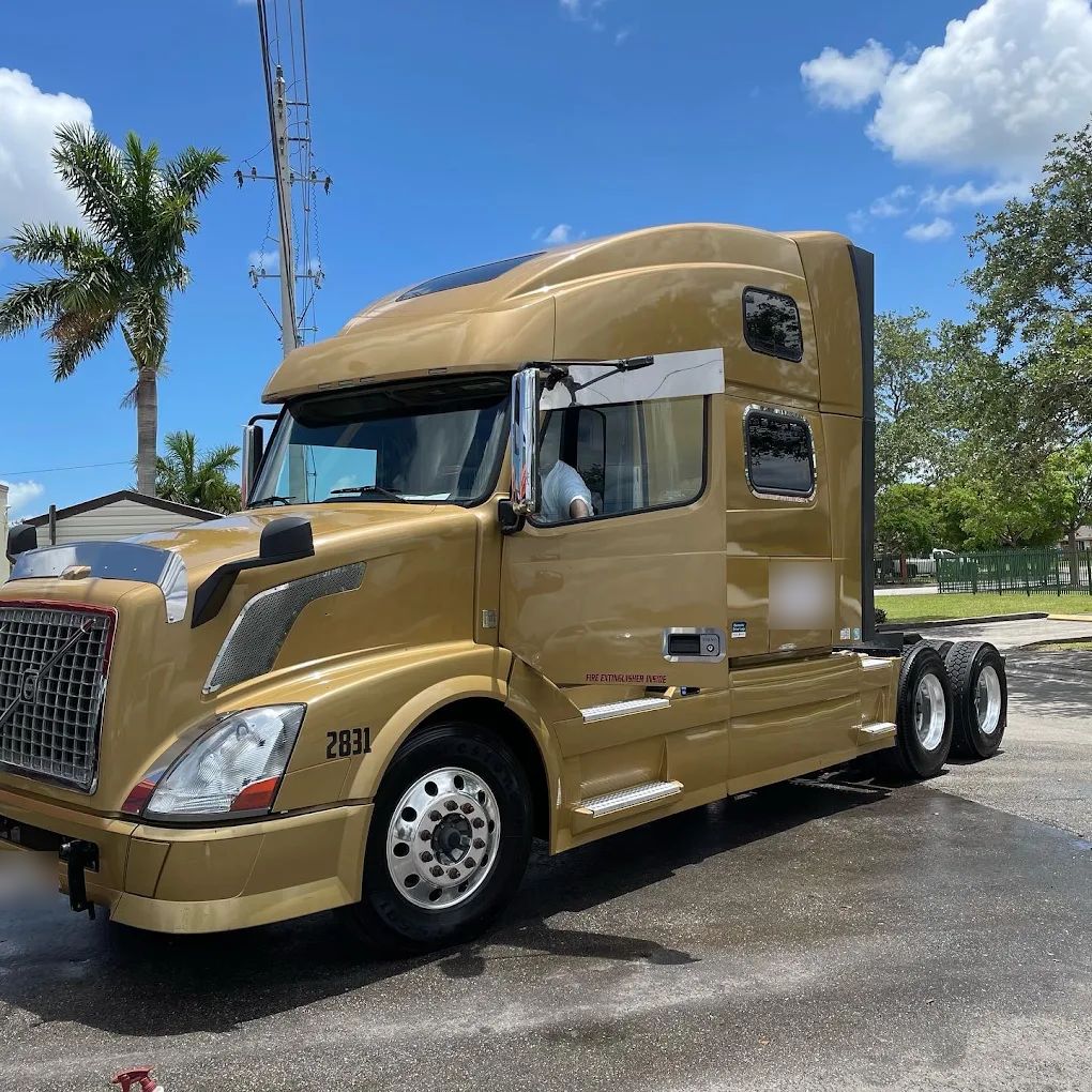 Gold Volvo semi truck cab washed at Car Wash Aguilon